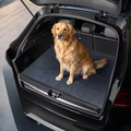 Dog sitting in a car boot fitted with a waterproof cargo liner