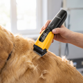 Cordless pet clipper trimming a dog's fur